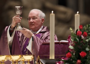 CARDINAL OUELLET ELEVATES CHALICE DURING OPENING MASS OF INTERNATIONAL CONGRESS ON CHURCH IN AMERICA