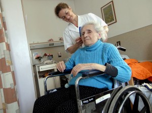 NURSE CARES FOR ELDERLY PATIENT AT CATHOLIC-RUN FACILITY IN JERUSALEM