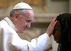 Pope Francis blesses woman as he meets with diplomats at Vatican